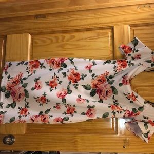 Brand new. Off the shoulder white flowered dress
